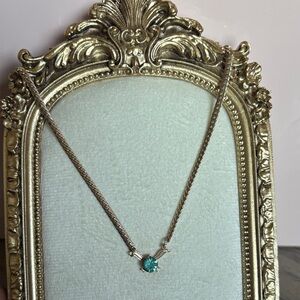 Vintage Gold-tone necklace with a blue rhinestone accent 14”